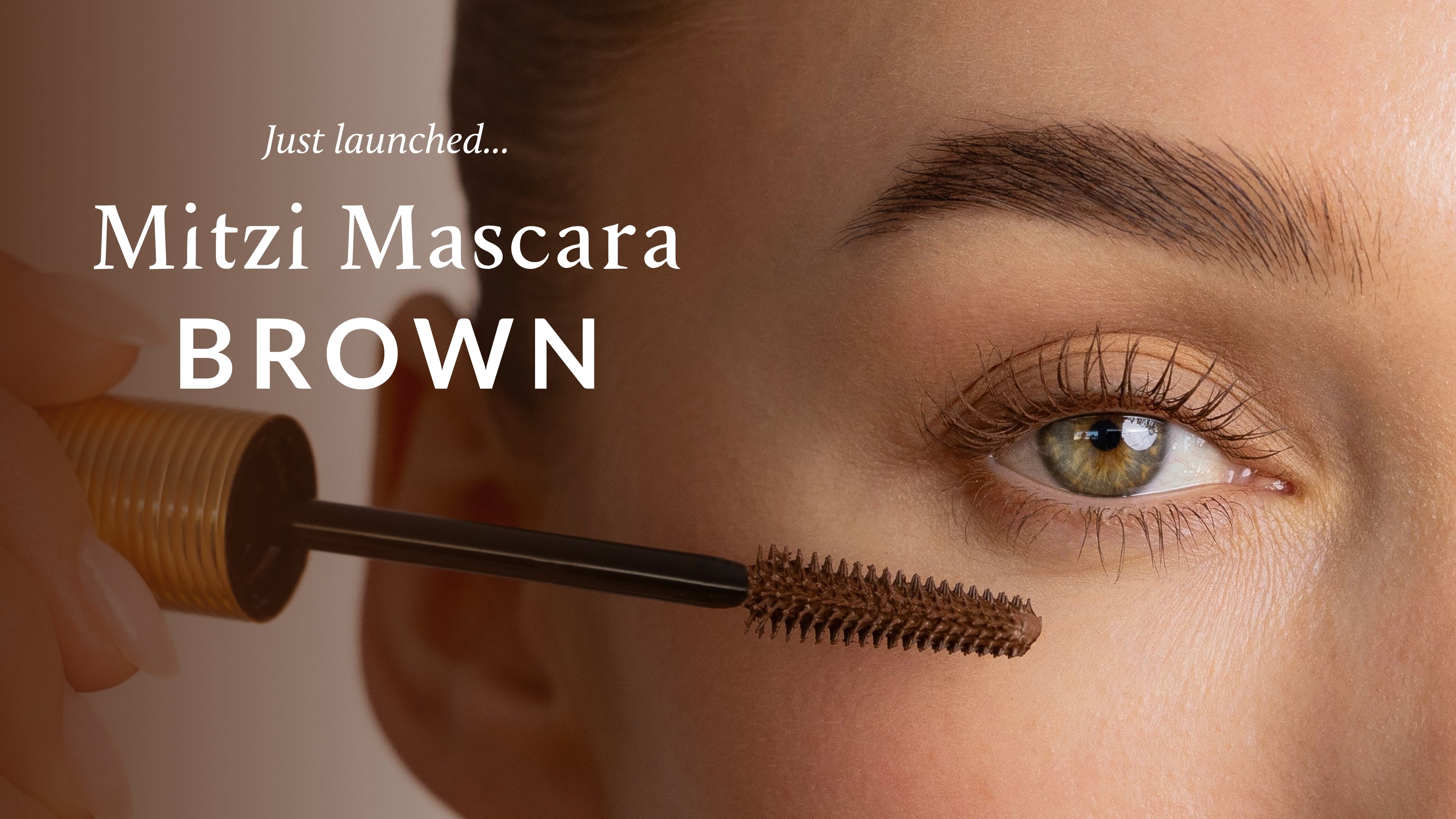 Close-up of an eye with Mitzi Mascara Brown mascara being applied, vegan natural-looking makeup