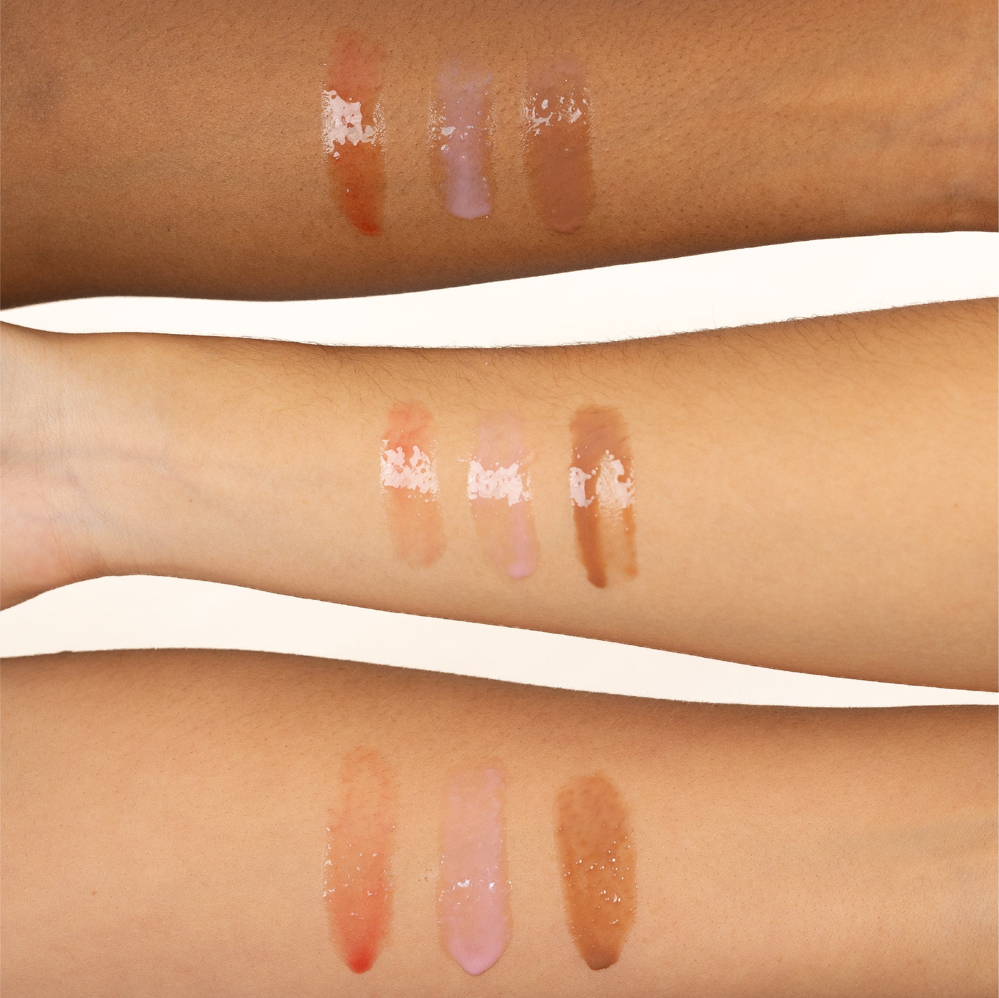 Close-up of three forearms with Glory Gloss swatches.