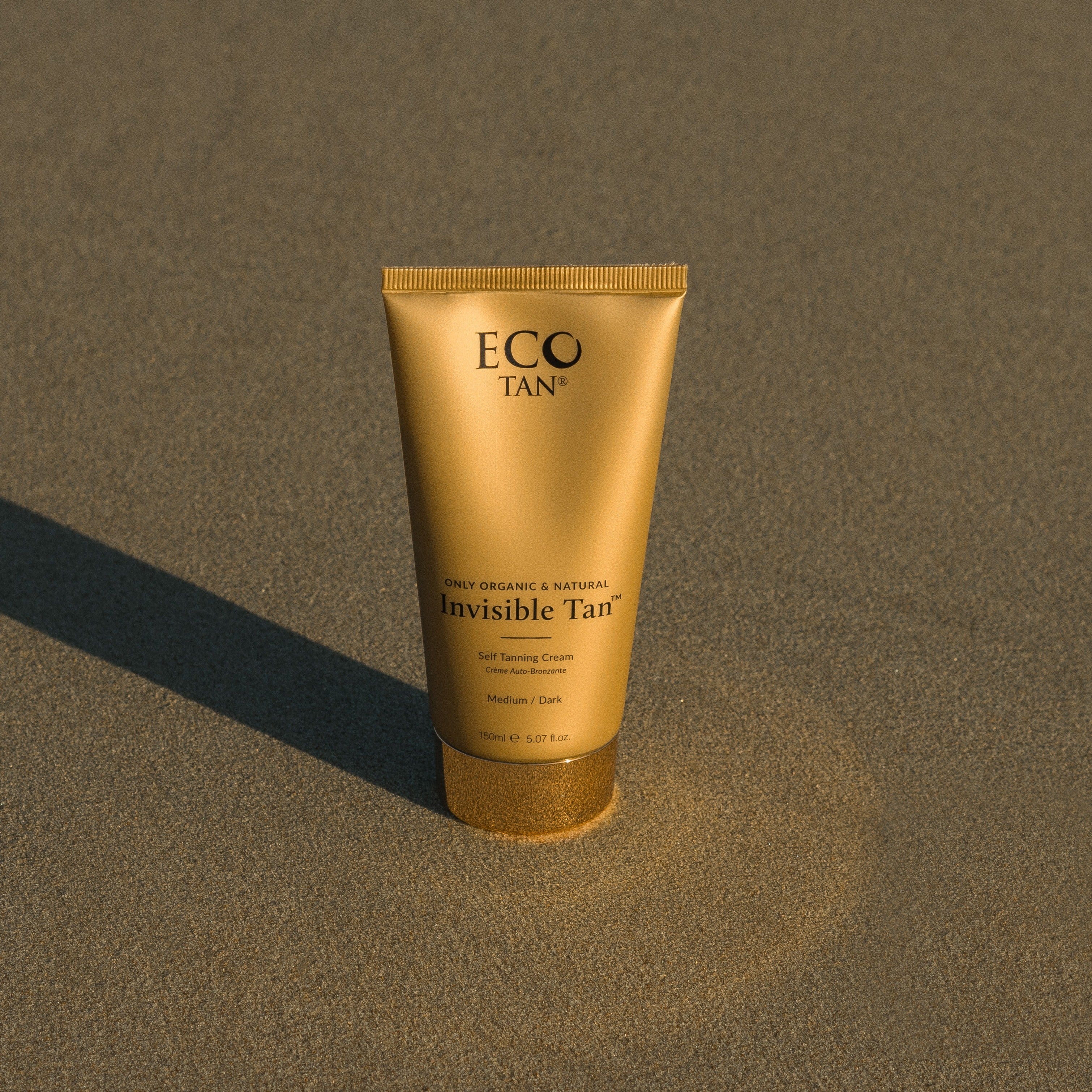 Invisible Tan - Eco Tan self tanning cream tube on beach