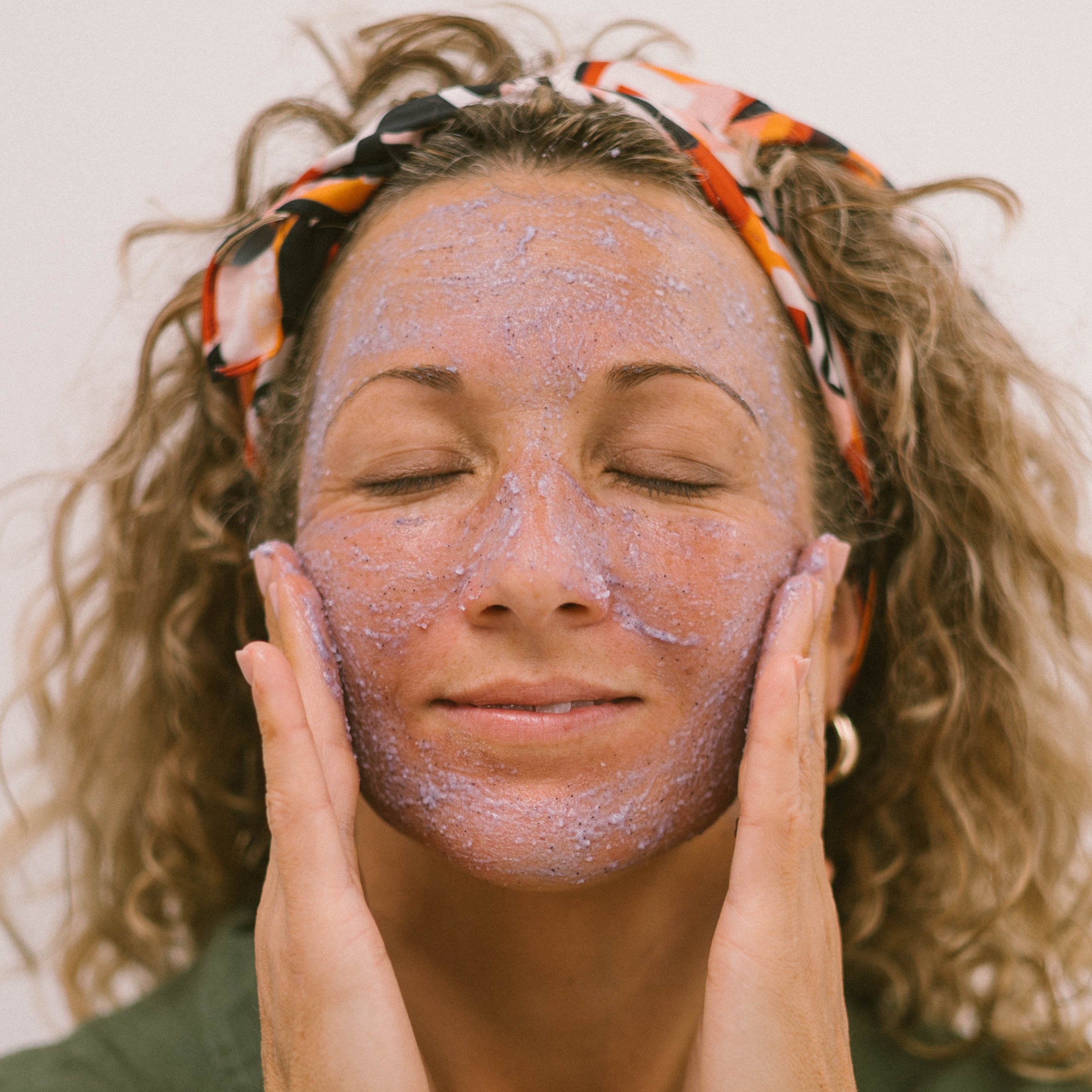 Super Acai Exfoliator scrub being applied to face